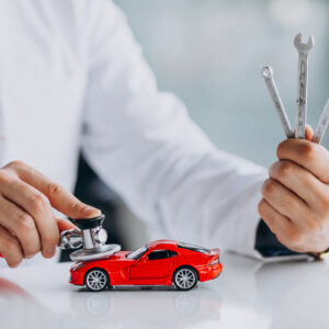 Car doctor with stethoscope in a car showroom