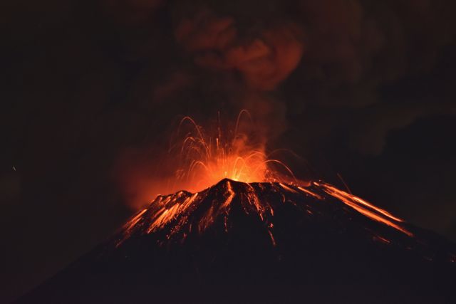 Smoke rises from the Popocatepetl as it spews incandescent volcanic material on the outskirts of Puebla