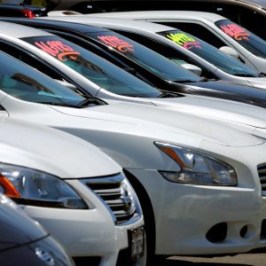 FILE PHOTO: Automobiles are shown for sale at a car dealership in Carlsbad, California