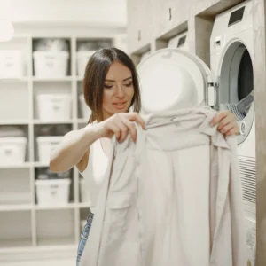 woman using washing machine doing laundry young woman ready wash clothes interior washing process co.webp