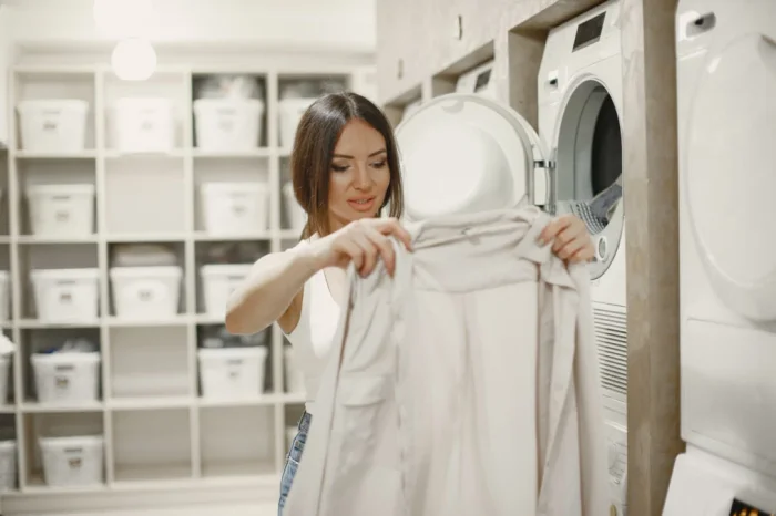 woman using washing machine doing laundry young woman ready wash clothes interior washing process co.webp