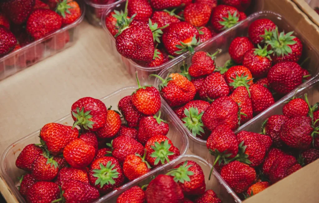 juicy ripe strawberries supermarket counter 1063x675.jpg