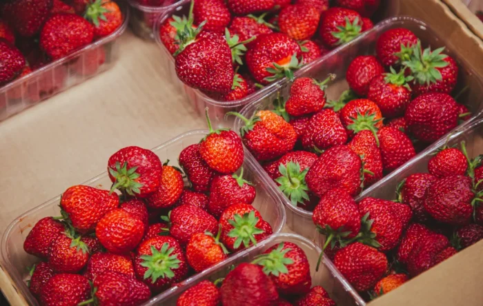 juicy ripe strawberries supermarket counter 1063x675.jpg